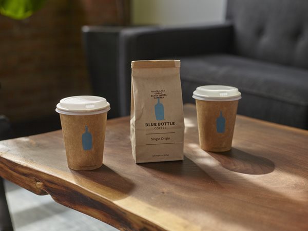 A photo that includes coffee cup, cup, and wood from Blue Bottle